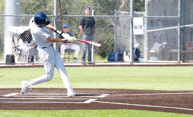 Noah Deason making contact, ball in flight